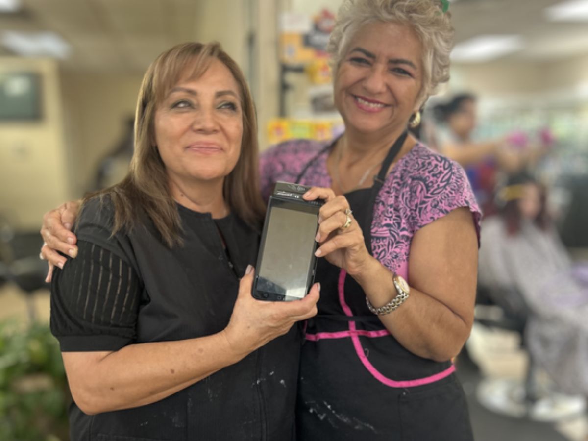 A real Gulf Coast salon team using their PayWavez payment terminal